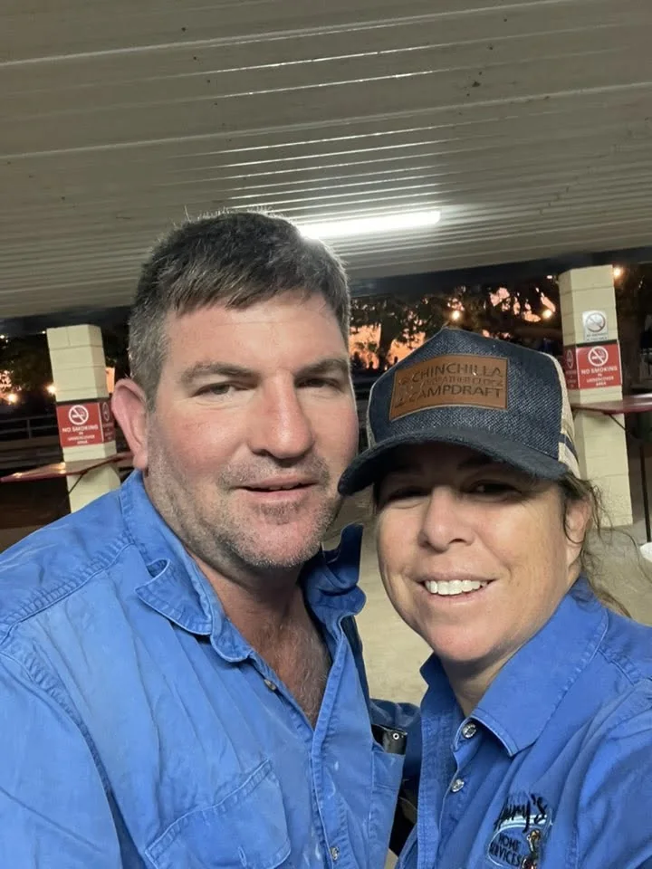 Two members of the Hairy's Home Services team wearing branded work shirts and caps